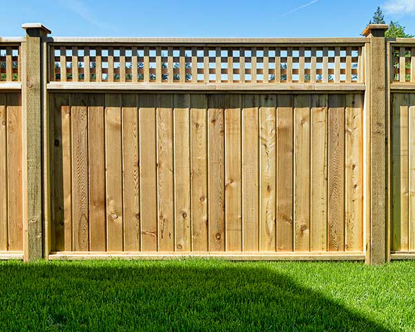 Decorative gate detail on wooden fence