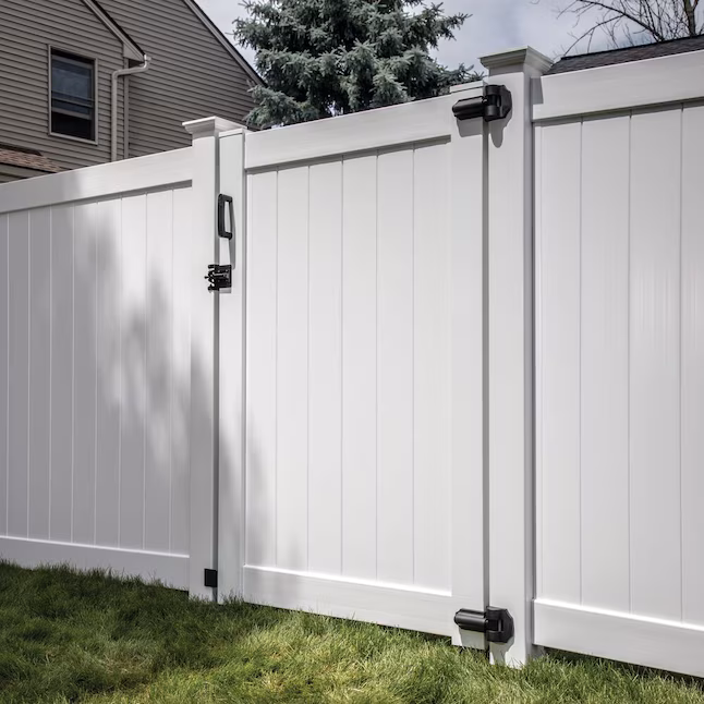 Happy family enjoying fenced backyard